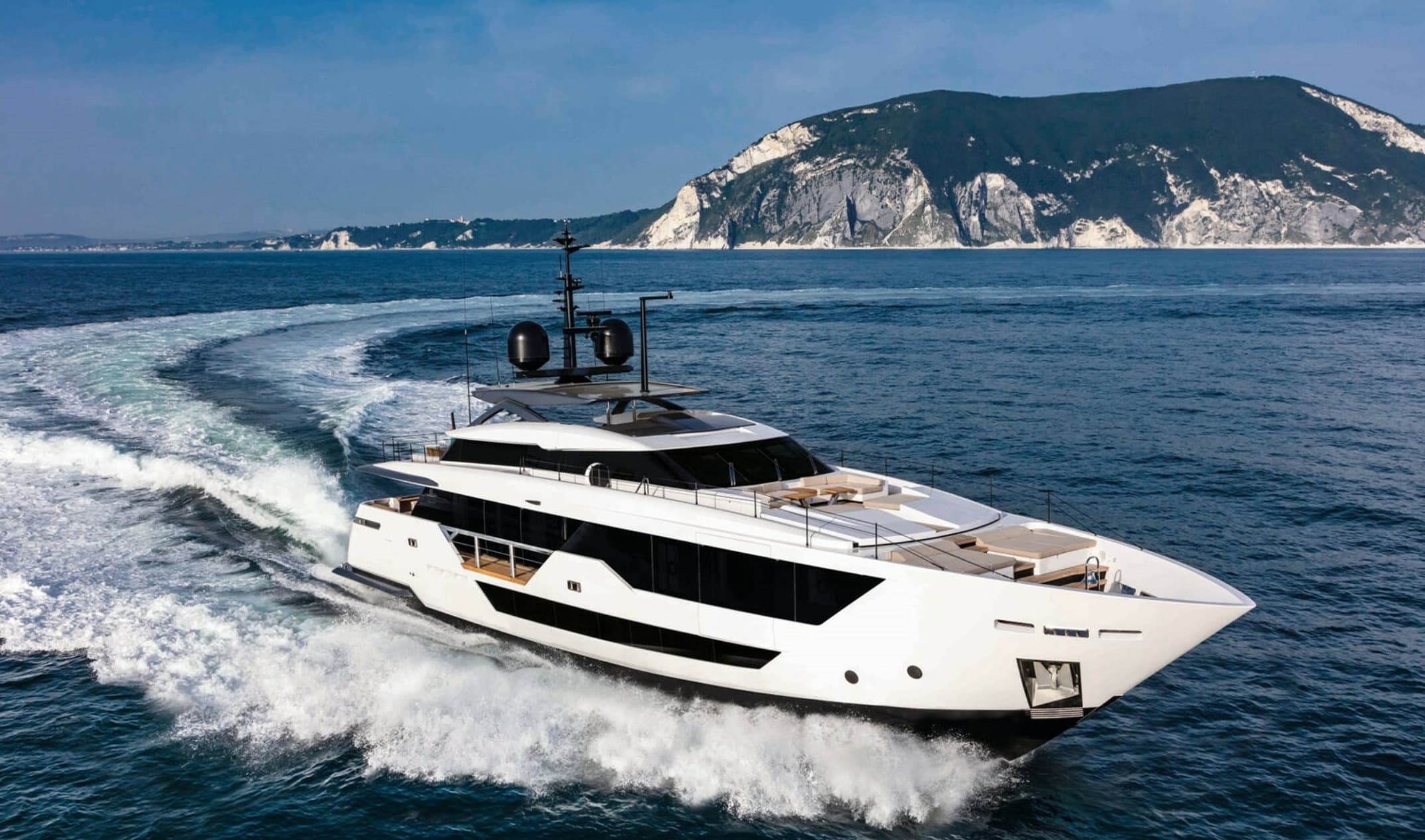 Custom Line motor yacht underway off the coast
